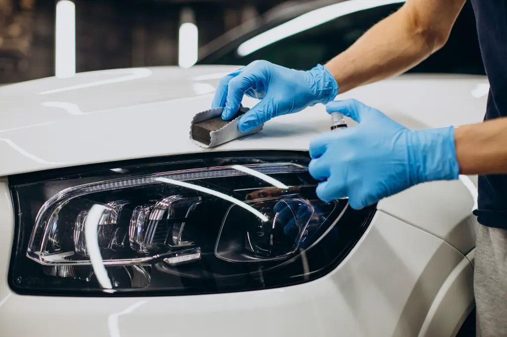man-working-car-detailing-coating-car.webp